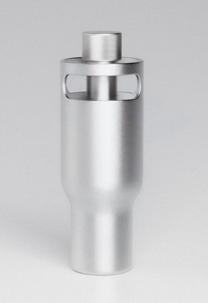 Metal water bottle with textured cap and integrated handles. Borrel Water Bottle by All Design Lab.