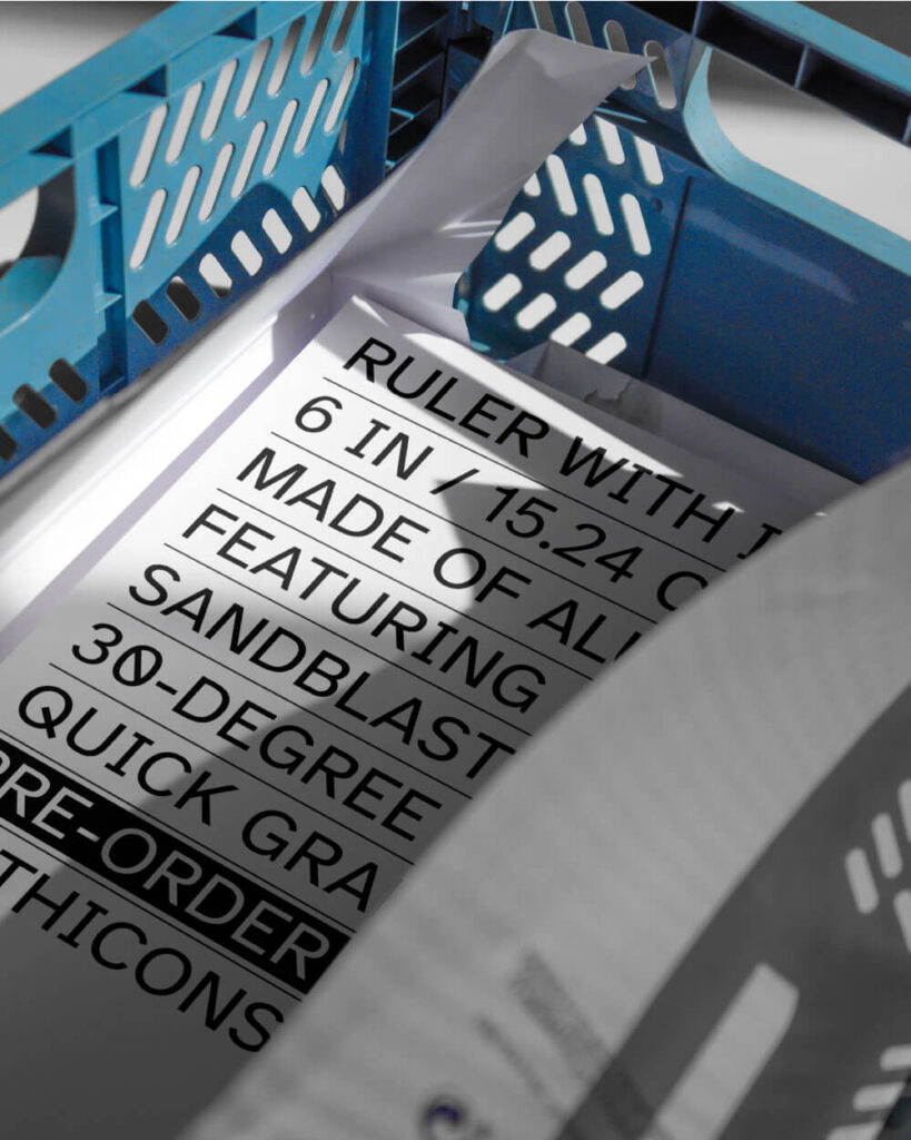 Paper with printed graphics inside blue tray. With Icons Branding by All Design Lab.